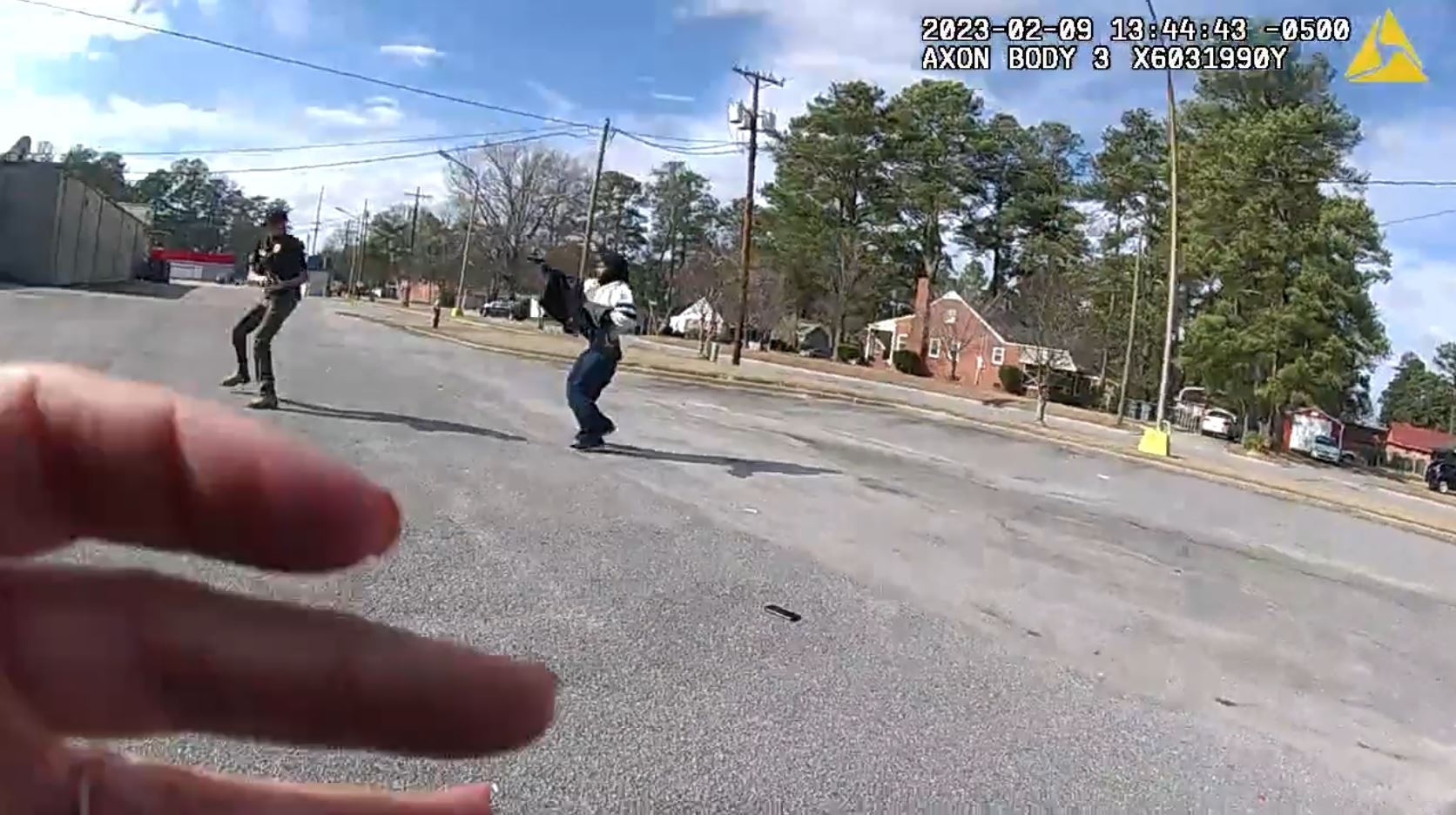 Man pointing gun at officer