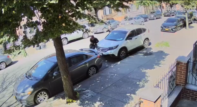 Image of the defendant firing two shots at the victim