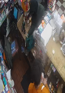 Image of the defendant threatening a victim with a firearm