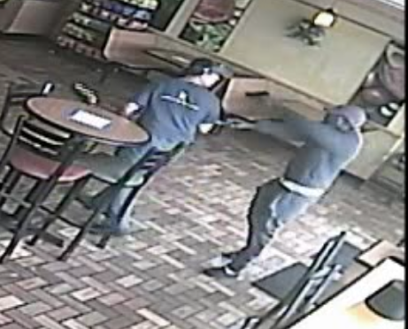 A screenshot of a video showing the attempted robbery of a restaurant in Maplewood.