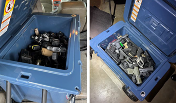Image of two large coolers filled with handguns. 