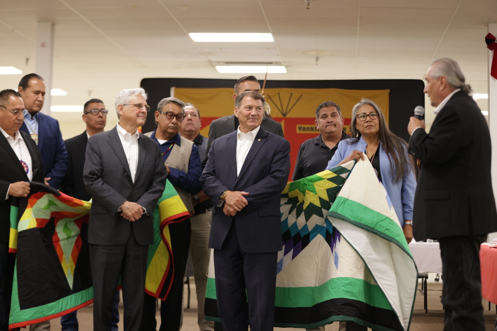 Attorney General Garland and Senator Rounds being honored with star quilts given on behalf of Tribal leaders.
