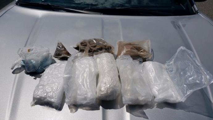Bags of seized heroin, methamphetamine, and fentanyl in clear bags