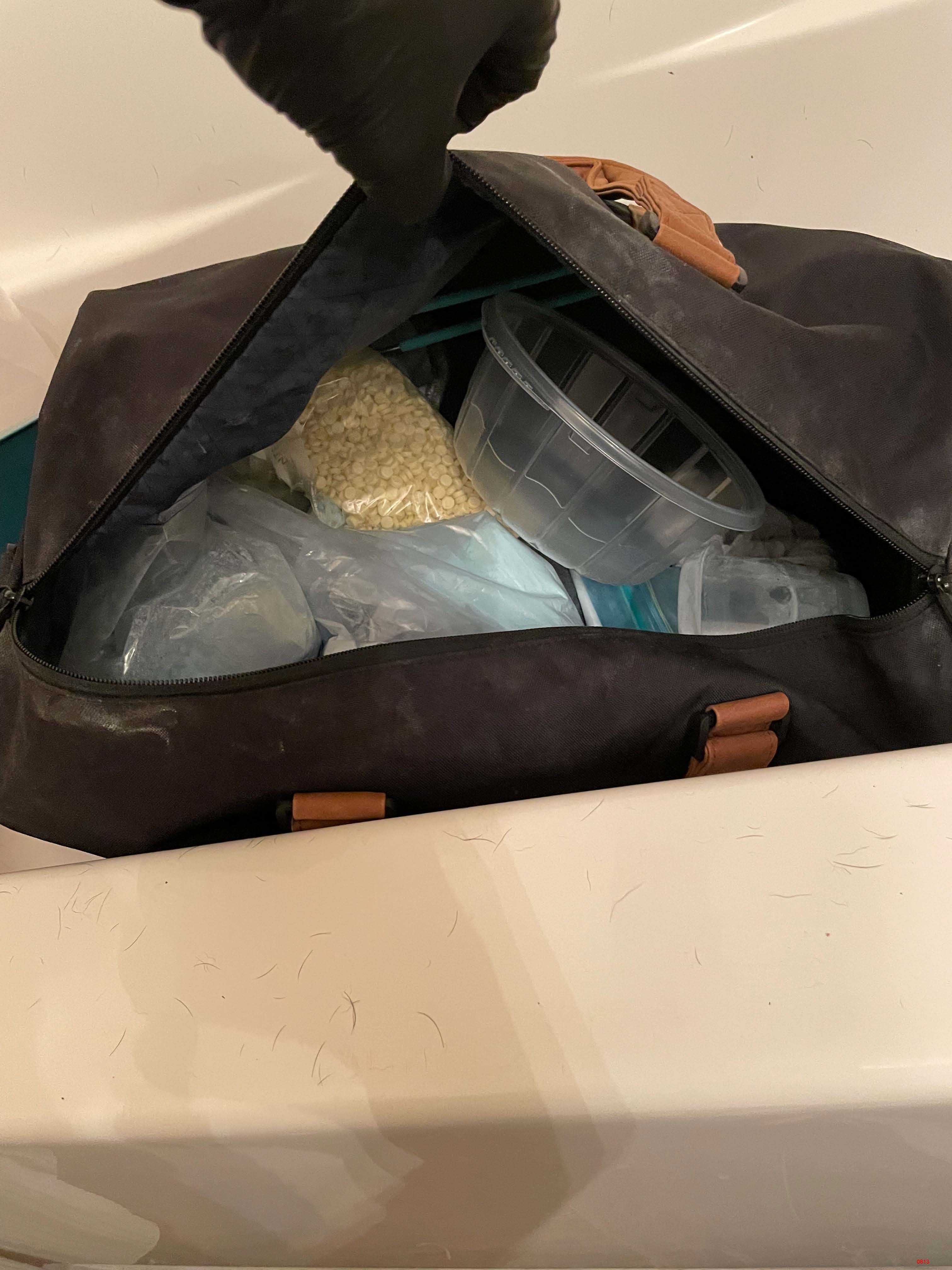 Photo of duffle bag and pills inside