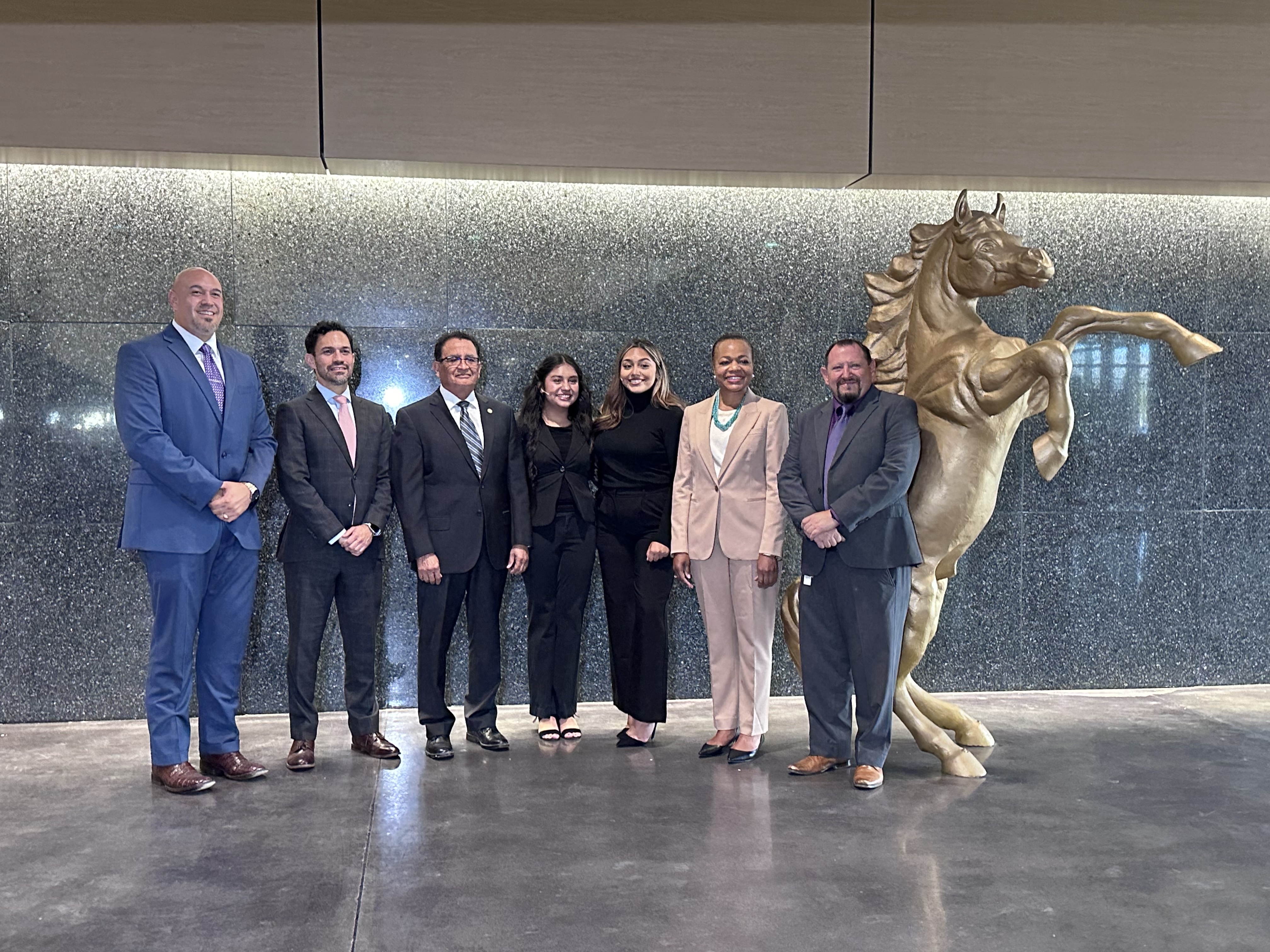 Assistant Attorneys General Clarke and Uriarte and U.S. Attorney Esparza with students and staff from Burges High School. Assistant Attorneys General Clarke and Uriarte and U.S. Attorney Esparza with students and staff from Burges High School.
