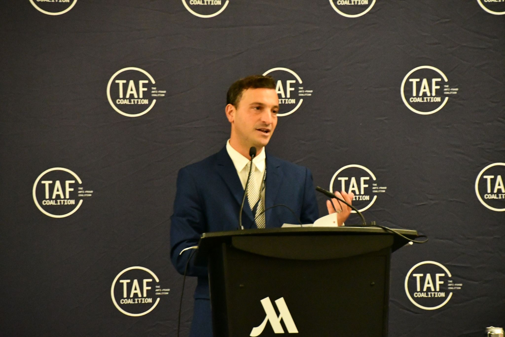 A picture of AUSA Dan Fruchter accepting his award 