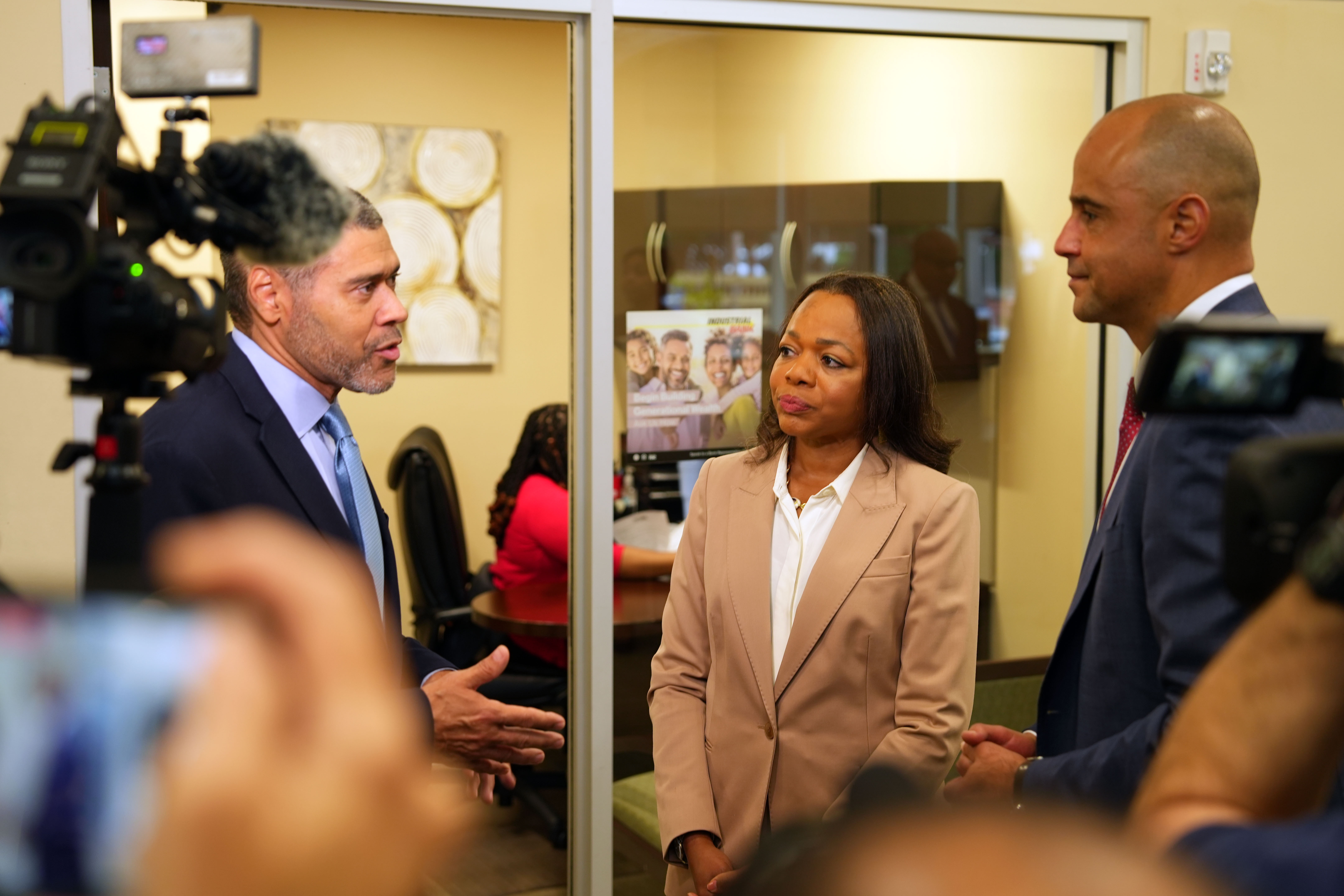 Assistant Attorney General Clarke and U.S. Attorney Graves meet with management at Industrial Bank.