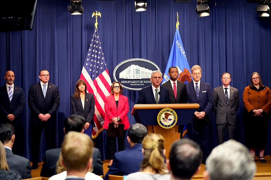 Attorney General Merrick B. Garland delivers at the Department of Justice. He is joined by Department of Justice and federal government officials.
