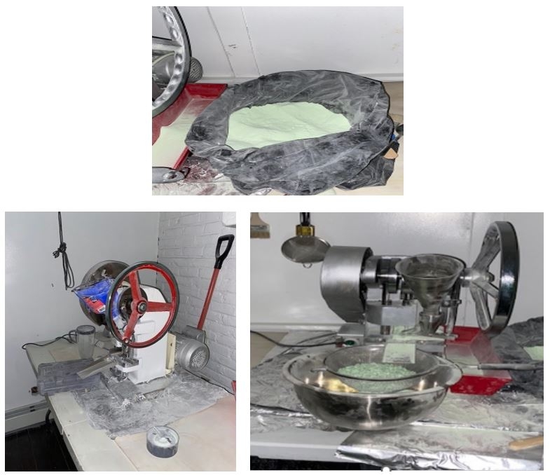 Bag of powdered fentanyl and two pill presses