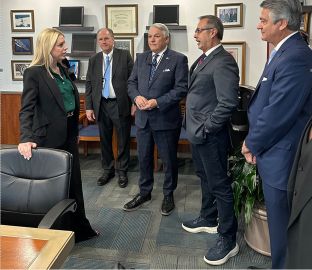 Attorney General Pam Bondi (left) standing with Tampa Port Leadership