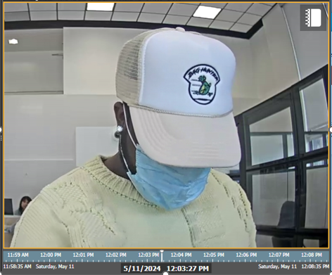 NOBORE withdrawing fraudulently obtained funds while prominently displaying the Bag Hunters logo