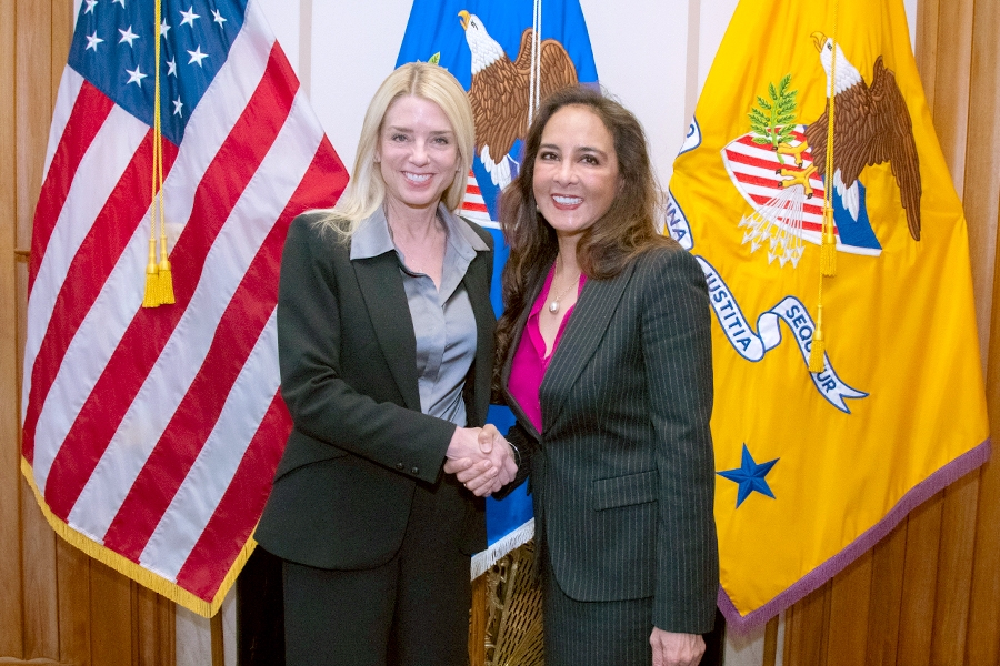 Attorney General Pamela Bondi shakes hand with the newly appointed Assistant Attorney General for the Civil Rights Division Harmeet Dhillon.