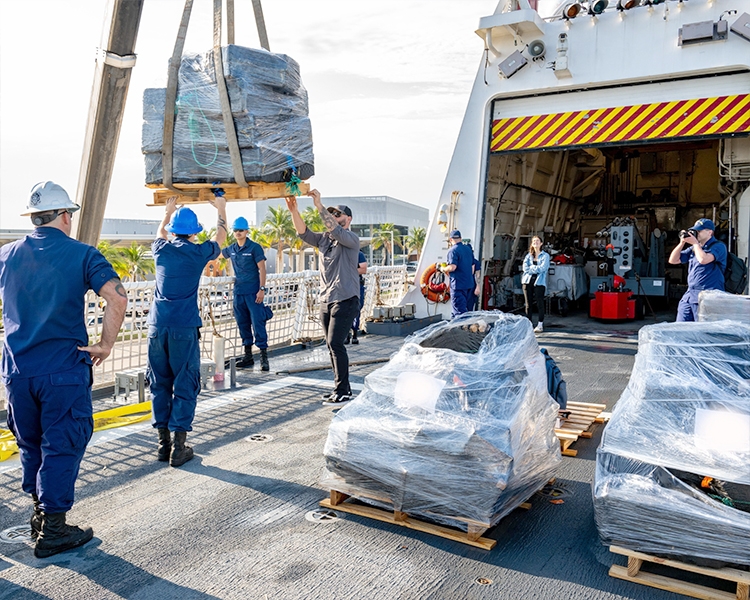 Pictured: U.S. Coast Guard move seized illegal drugs at Port Everglades, Florida.
