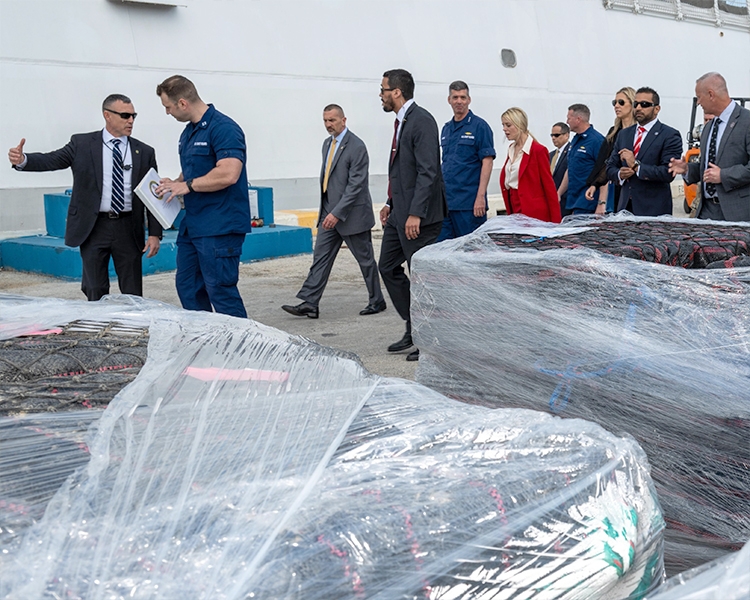 Pictured: U.S. Coast guard officials show Attorney General Pamela Bondi and F.B.I. Director Kash Patel the seized illegal drugs at Port Everglades, Florida.
