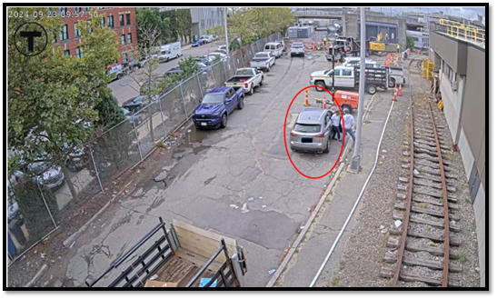 Mendes (circled in red below) sitting inside her vehicle