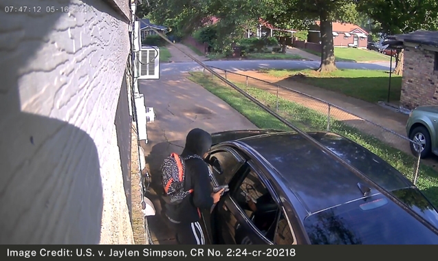 Surveillance Image from the Victim's Home of Simpson Entering the Vehicle After Shooting the Victim