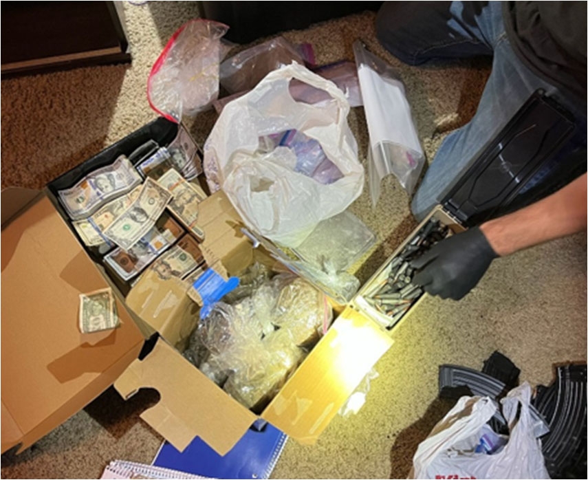 Boxes containing cash and illicit drugs