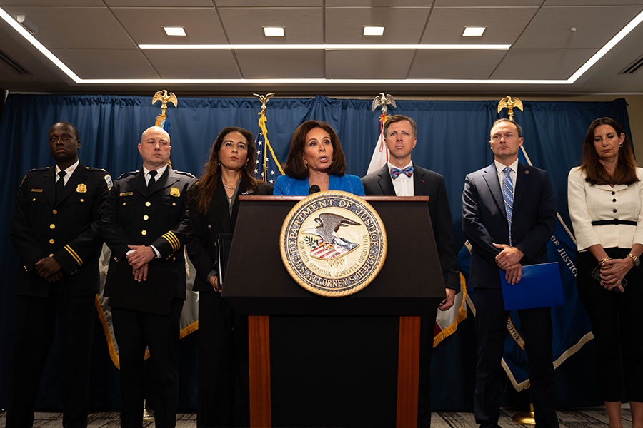 U.S. Attorney for the District of Columbia Jeanine F. Pirro delivers remarks from a podium at the U.S. Attorney’s Office for the District of Columbia. She is joined by Assistant Attorney General for Civil Rights Harmeet K. Dhillon as well as Federal and government officials from the Metropolitan Police Department and the Washington Field Office of the FBI.