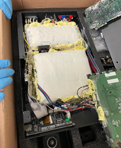 Two blocks of meth placed in an electronic device inside a cardboard box. 