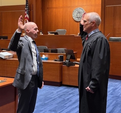 Scott Bradford swearing in with Judge Mosman