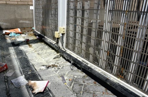 fire damage to scattered debris and gate