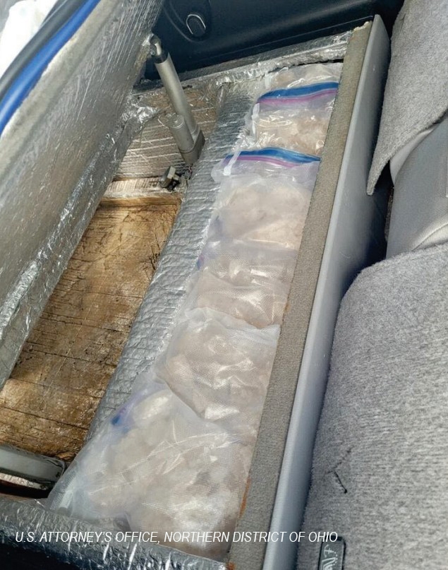 Drugs in a hidden compartment in a vehicle