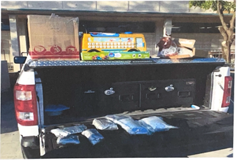 Sesame Street toy and bags of fentanyl displayed