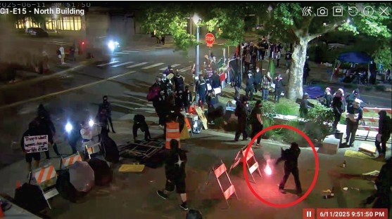 Defendant throwing lit flare