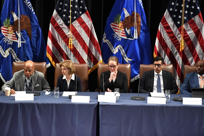 Commissioners seated at a panel table with American flags during the final hearing of the White House Religious Liberty Commission at the Museum of the Bible in Washington DC April 13 2026