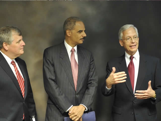 Attorney General Holder flanked by Acting Deputy Attorney General Grindler and Ernie Allen, President and CEO of the National Center for Missing and Exploited Children discuss the role of nonprofits as they wait for the press conference to begin.