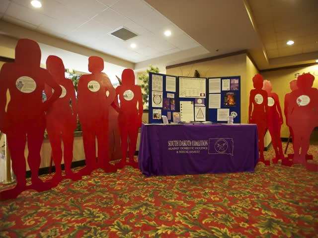 South Dakota Coalition Against Domestic Violence distributes information at the conference of the Attorney Generals Advisory Committee Native American Issues Subcommittee in Rapid City, S.D.
