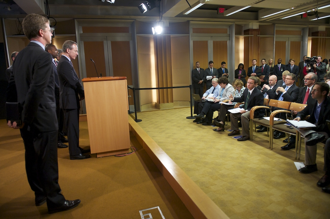 A crowd watches on as New York Attorney General Eric Schneiderman announces the actions taken by the RMBS Working Group.