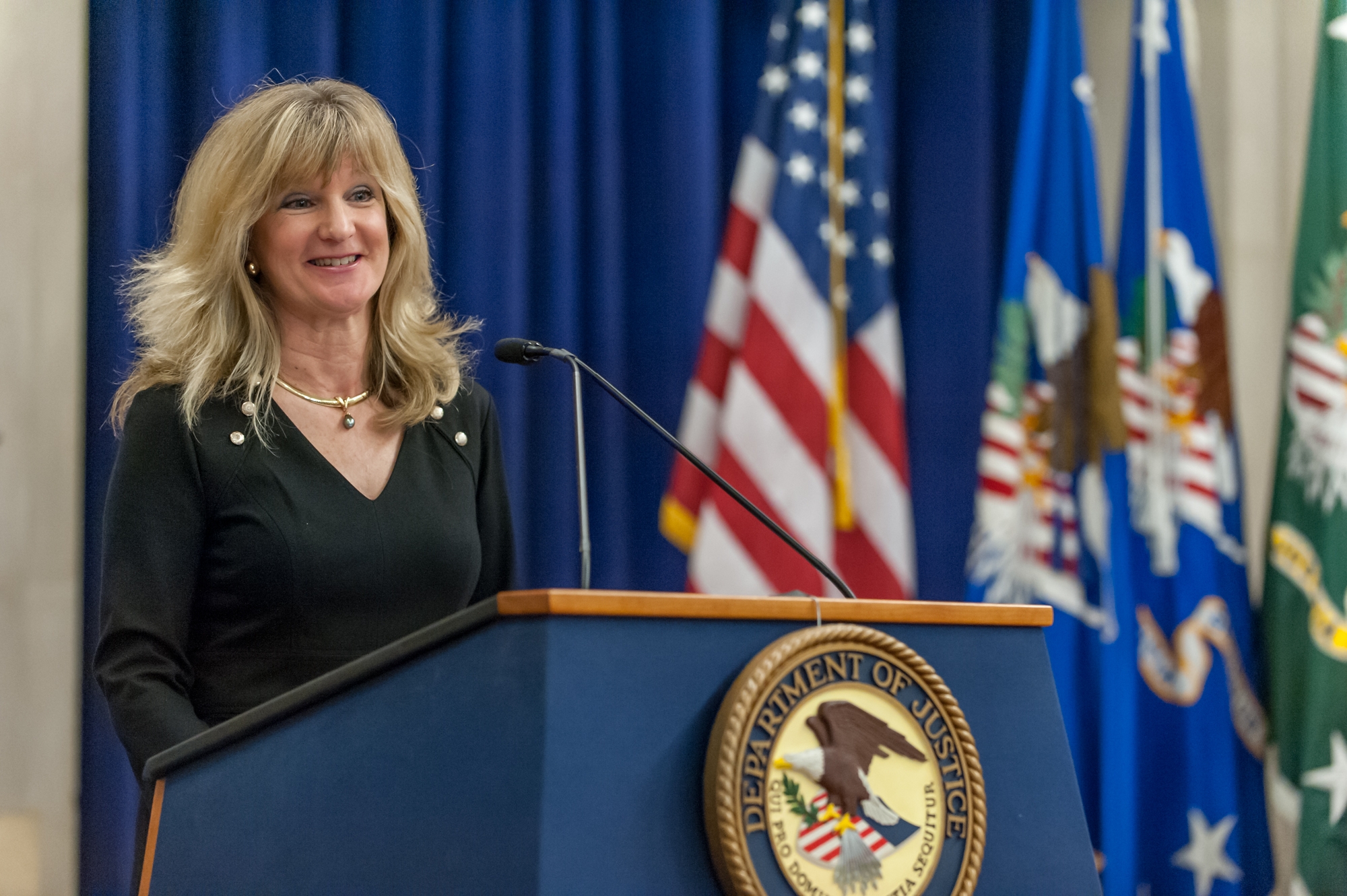 OIP Director Melanie Ann Pustay welcomes everyone to the Department of Justice's fourth anniversary celebration of Sunshine Week.