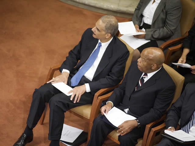 Attorney General Holder and Congressman Lewis, sitting together.