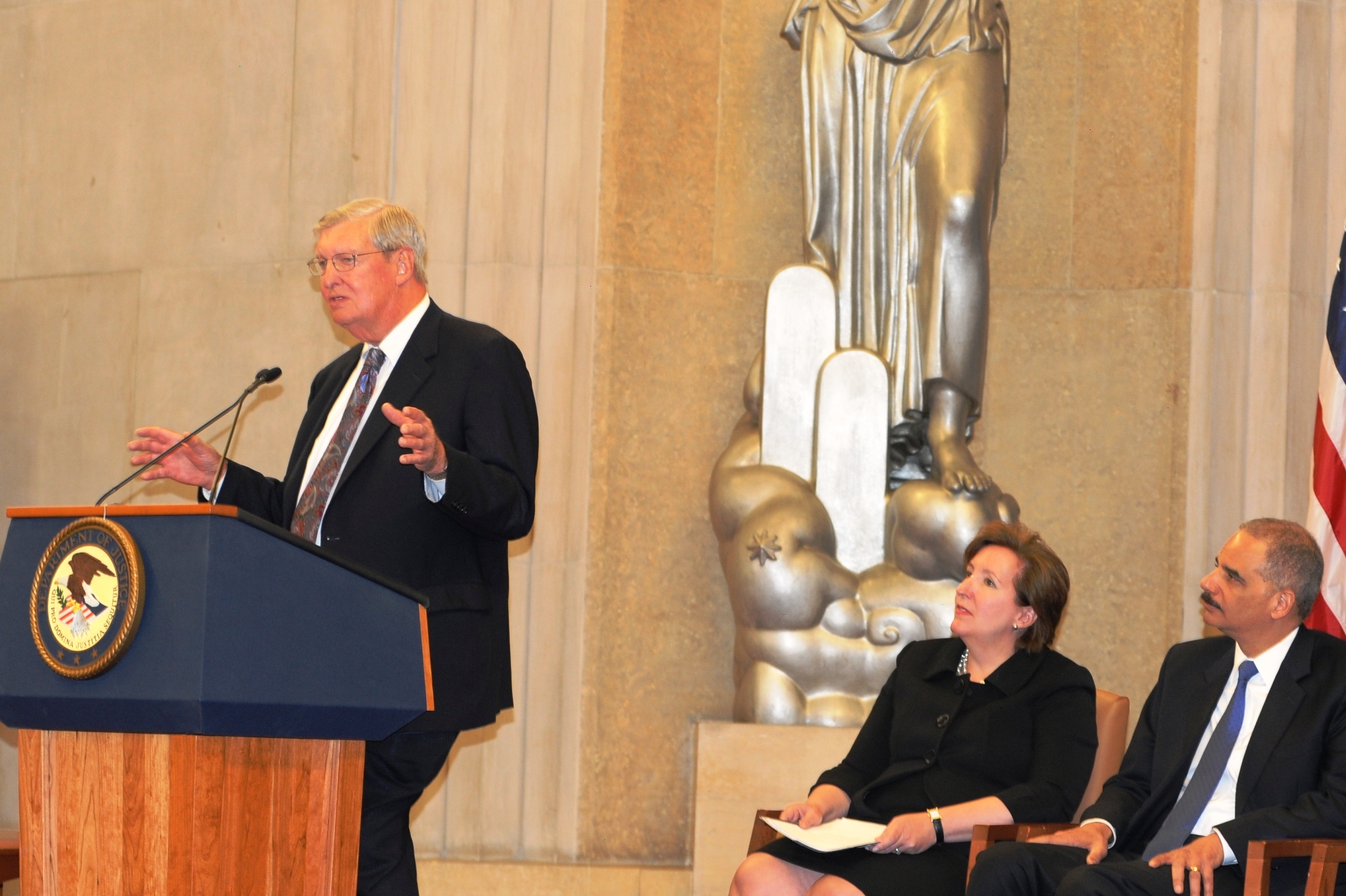 2012 Sherman Award recipient James F. Rill gives remarks after receiving the award from Attorney General Eric Holder.
