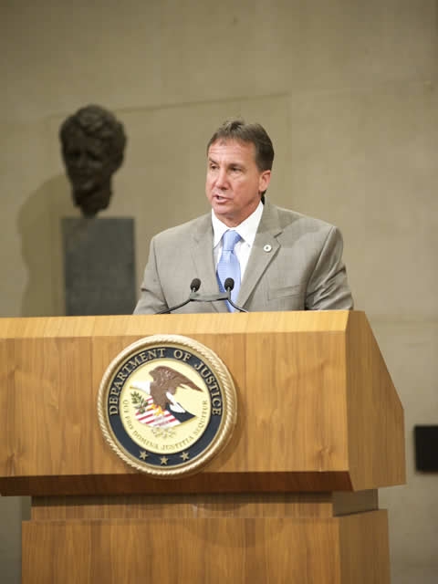 INTERPOL Director Timothy Williams delivers remarks at his installation.