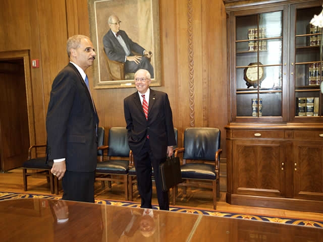 Attorney General Holder and former Attorney General Mukasey talk.