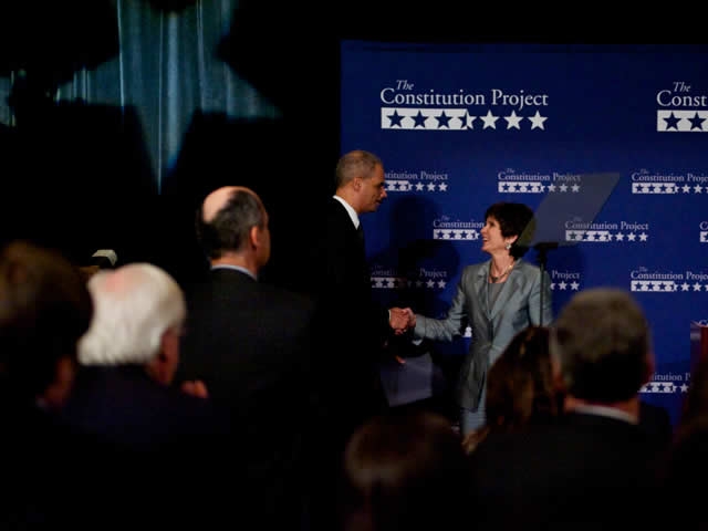 Attorney General Holder greets and thanks Virginia Sloan, the president and founder of the Constitution Project and a member of its Board of Directors.