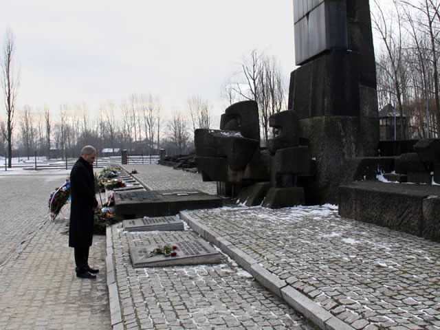Attorney General Holder lays a wreath at the International Monument to the Camp Victims at the Auschwitz-Birkenau Memorial and State Museum.