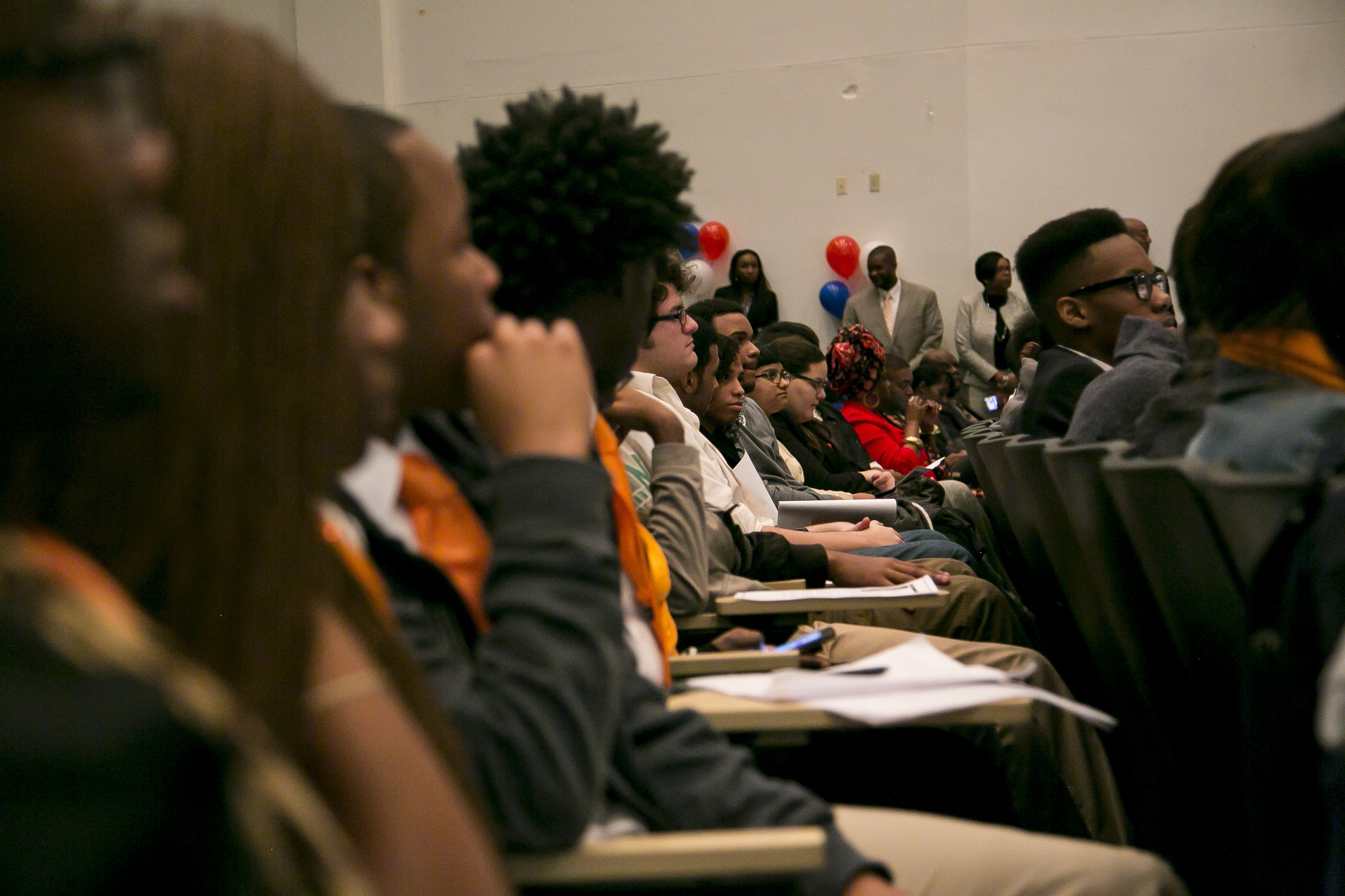 Attorney General Lynch, Student Peace Ambassadors, and officers discuss police-community relations at a youth down hall at Miami