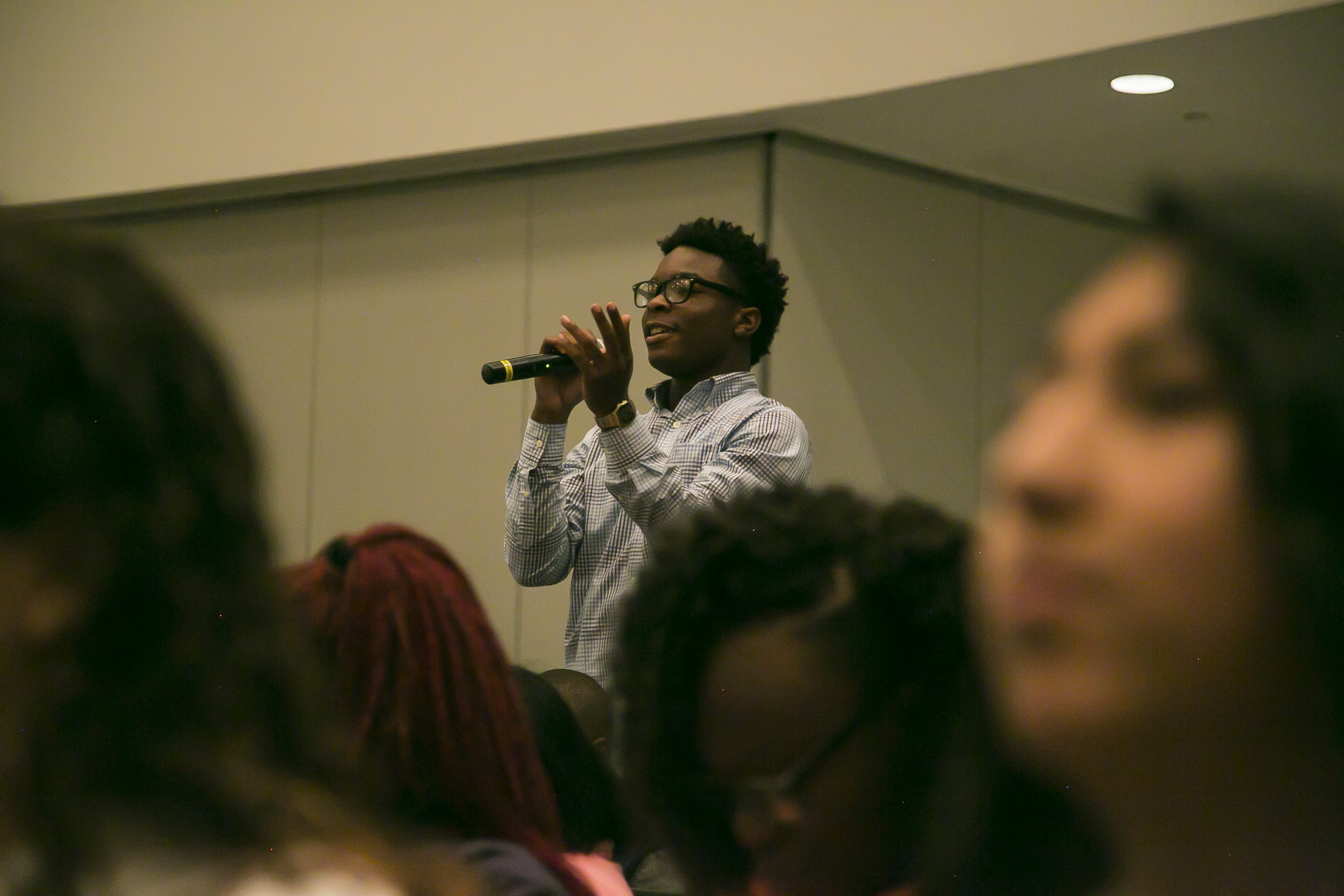 Attorney General Lynch, Student Peace Ambassadors, and officers discuss police-community relations at a youth down hall at Miami
