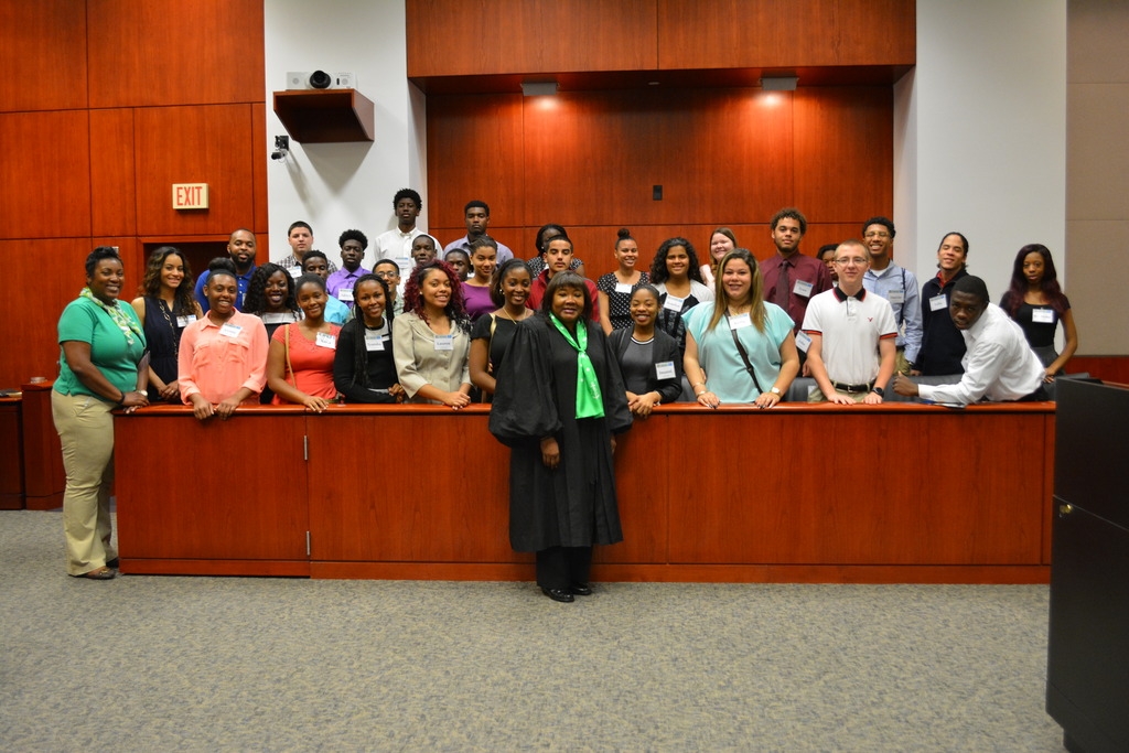 A group shot with U.S. District Judge Charlene Edwards Honeywell.
