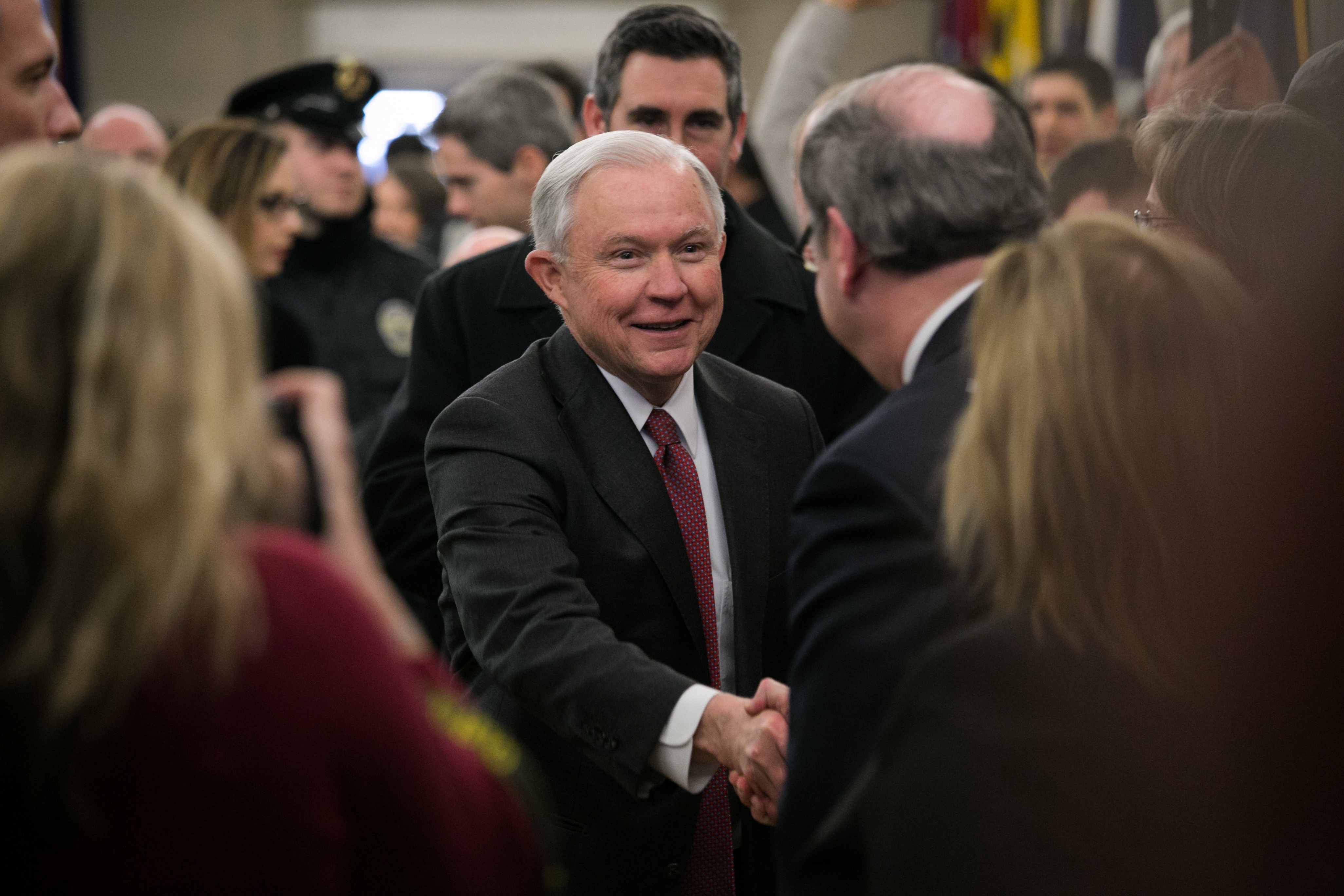 After taking his oath of office, Attorney General Sessions greets employees as he arrives at the Department of Justice.