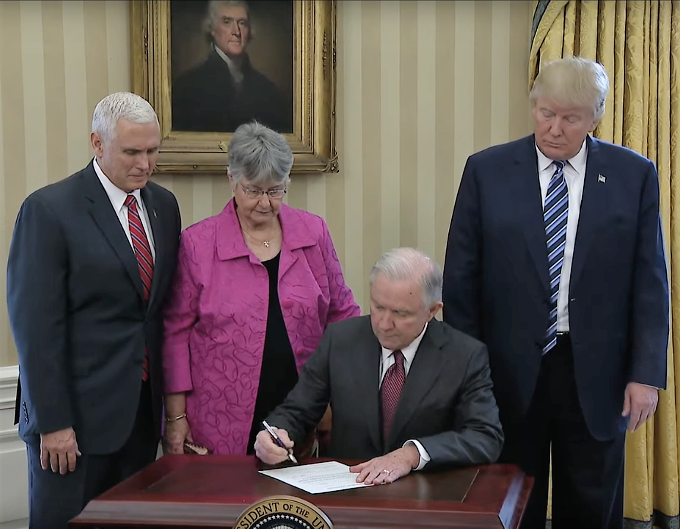 Attorney General Jeff Sessions signs his oath of office with President Trump, Vice President Pence, and his wife Mary.