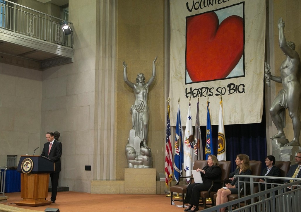 Deputy Attorney General Rod Rosenstein congratulates recipients