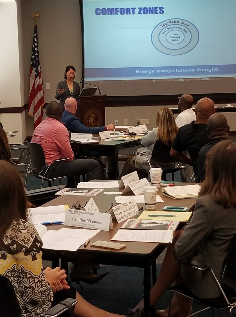 USAO Orlando Division Chief Kathy Ho welcomes attendees.