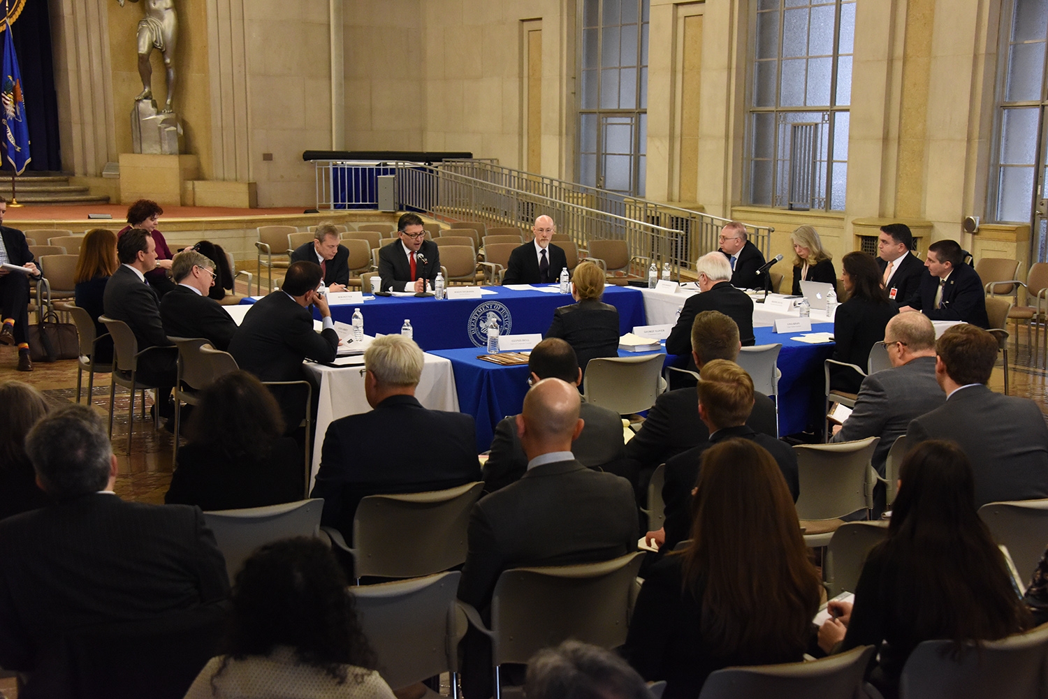 Makan Delrahim (center), Antitrust Division staff, Roundtable Participants, and members of the public participating in the Public Roundtable Discussion Series on Deregulation &amp; Antitrust Law in the Great Hall of the Main Justice Building