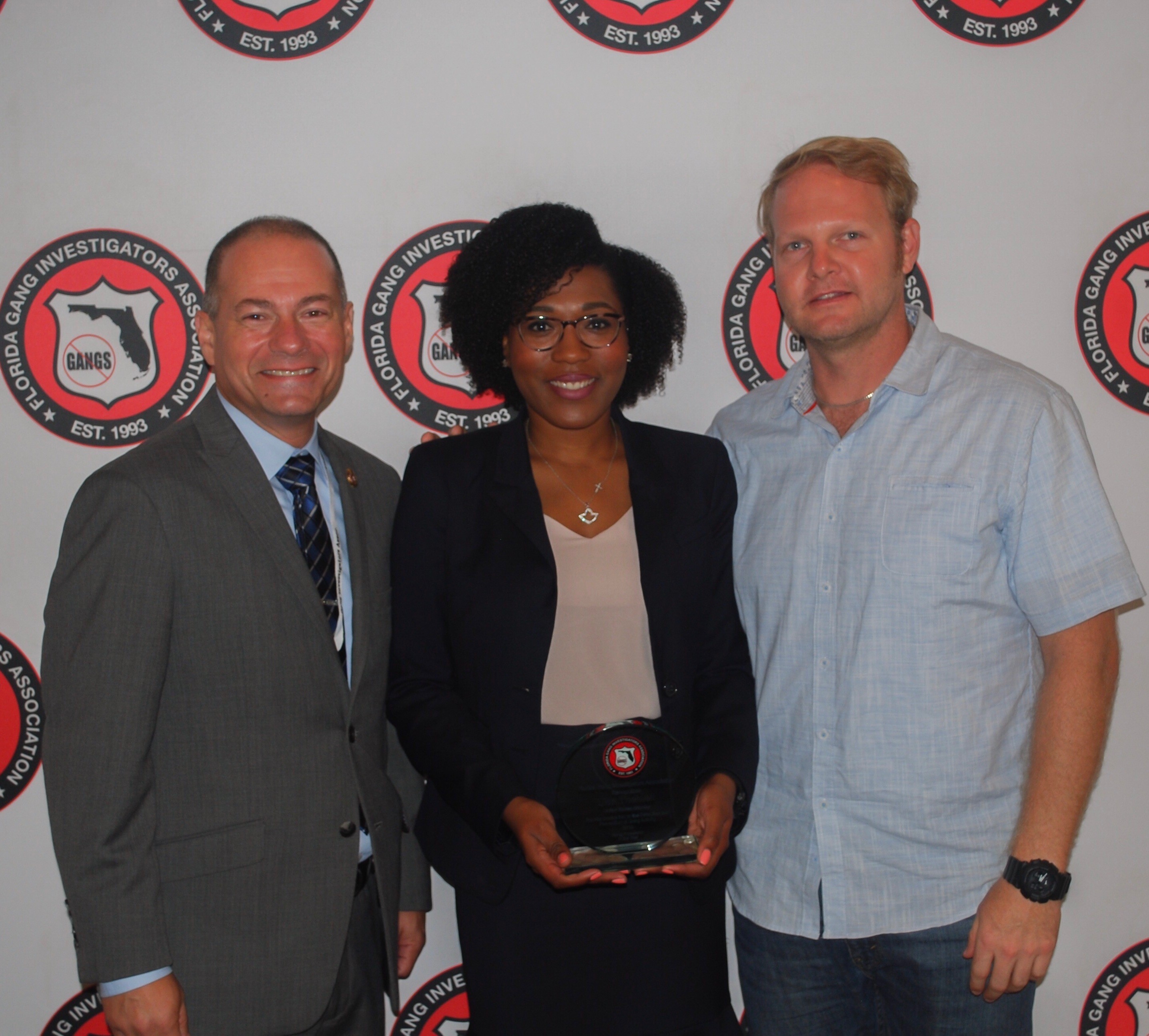AUSA Lisa Thelwell accepts her award from FGIA