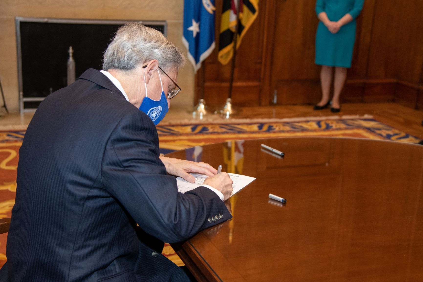 Judge Garland signs his oath of office as the 86th Attorney General of the United States.