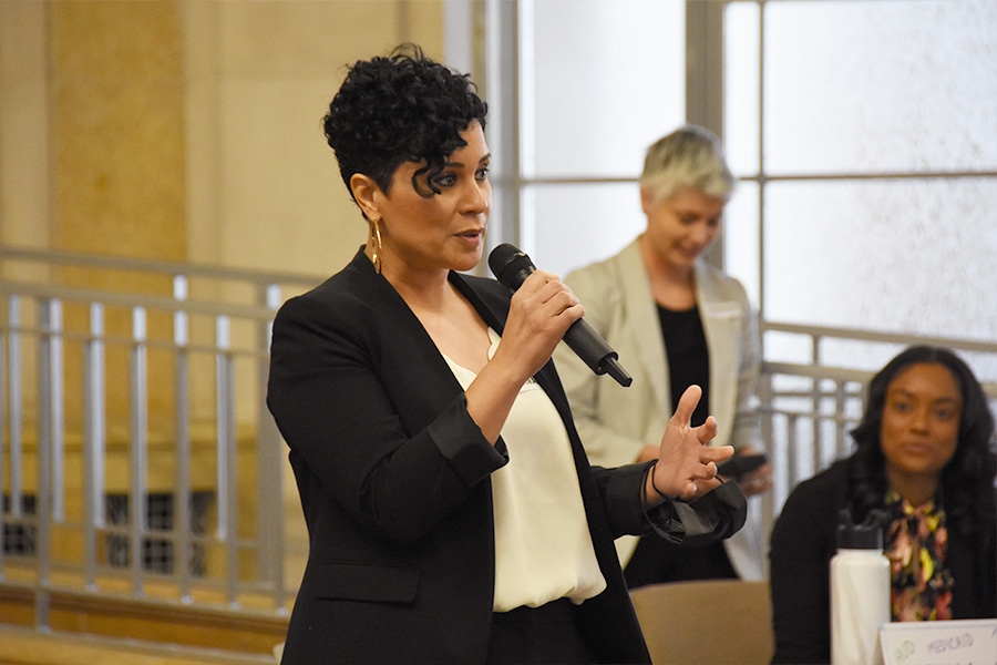 A Reentry Coordination Council member shares her knowledge of obstacles to re-entry with the participants.